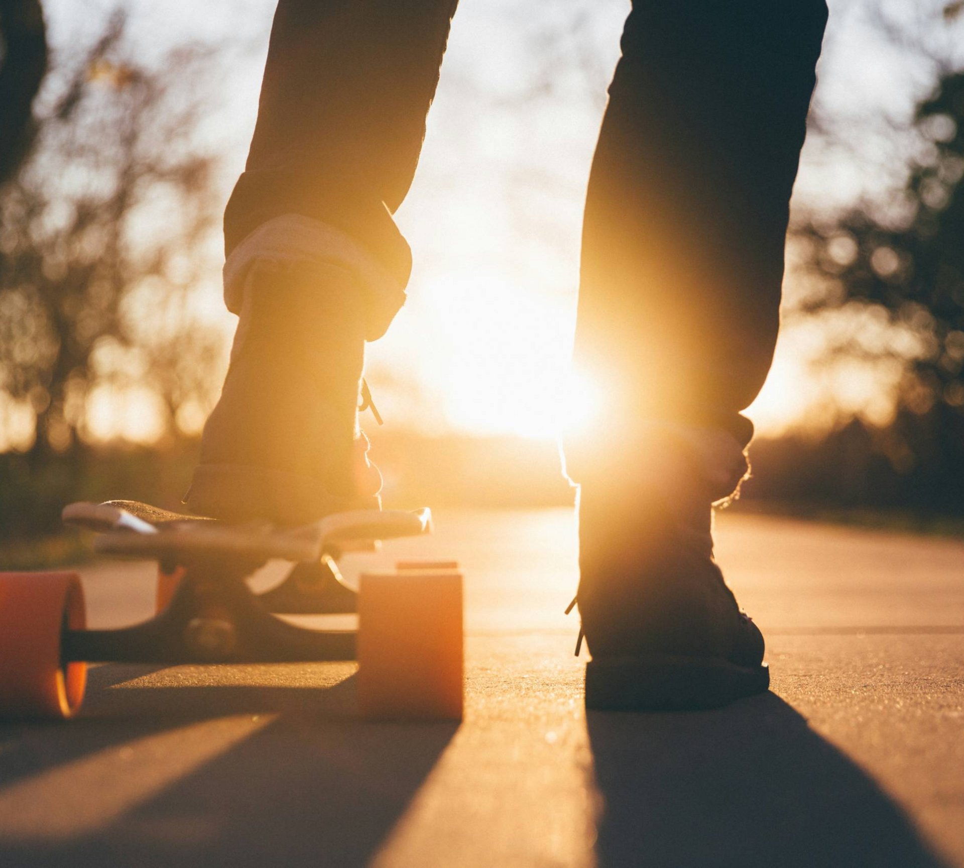 Person on skateboard at sunset in the park