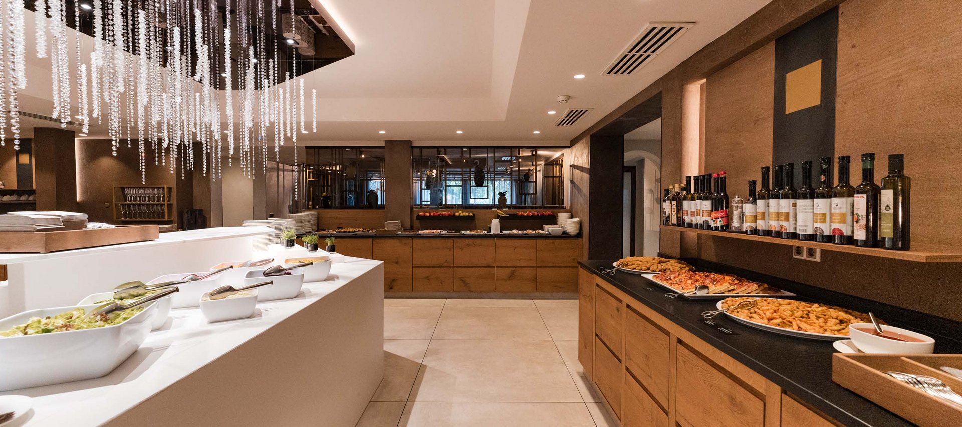 Modern buffet with food and wine in cozy restaurant